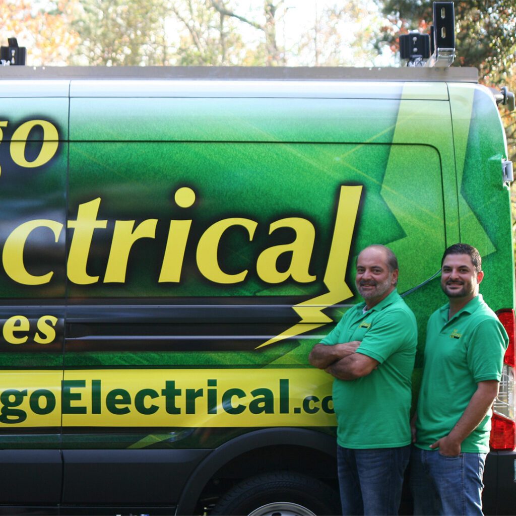 Go Electrical: Two electricians by van.