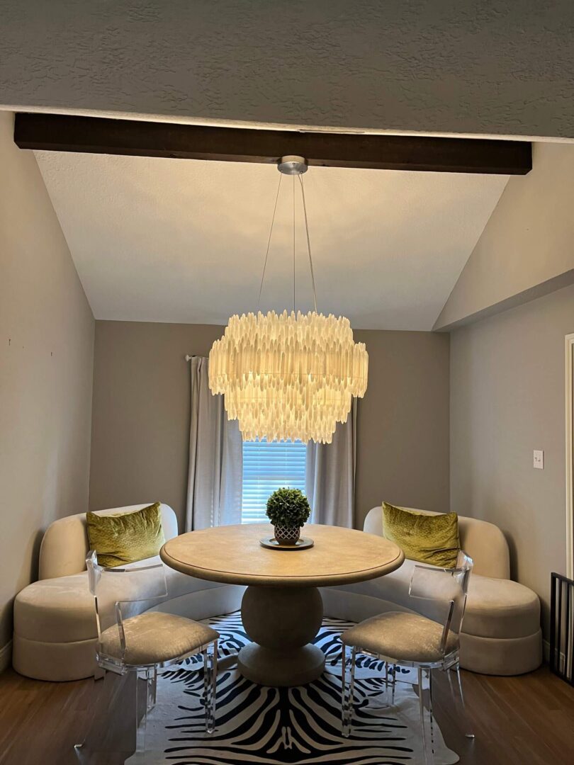 E9C419BF-2BD5-414C-B4CA-AA6943AEE873 Modern dining room with crystal chandelier.
