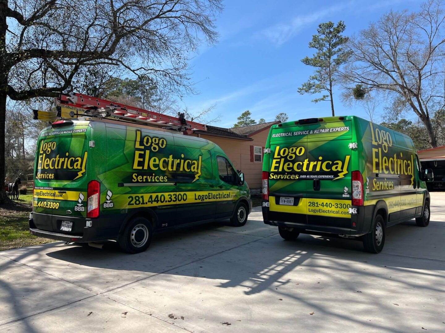 Electrician working on a breaker box outside a stone home, performing electrical repairs and panel maintenance.