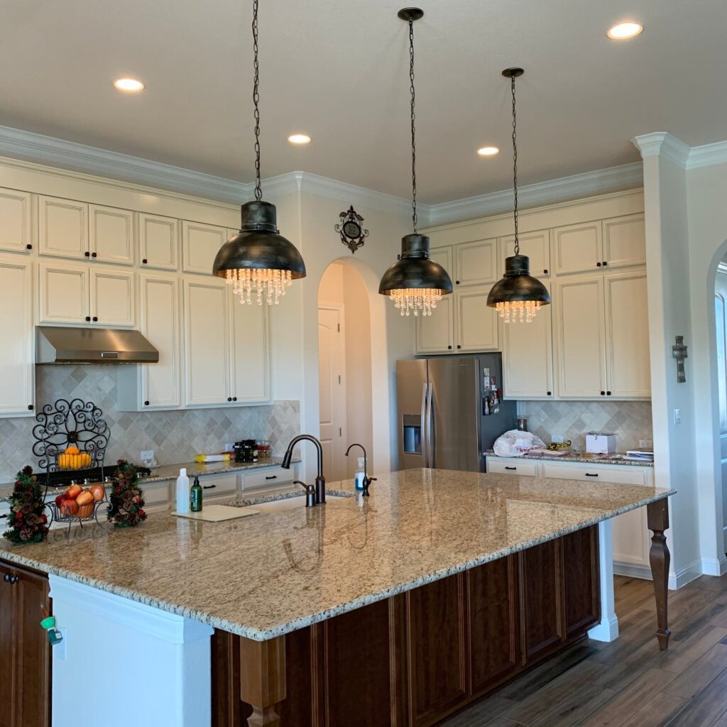 Kitchen island with three pendant lights.