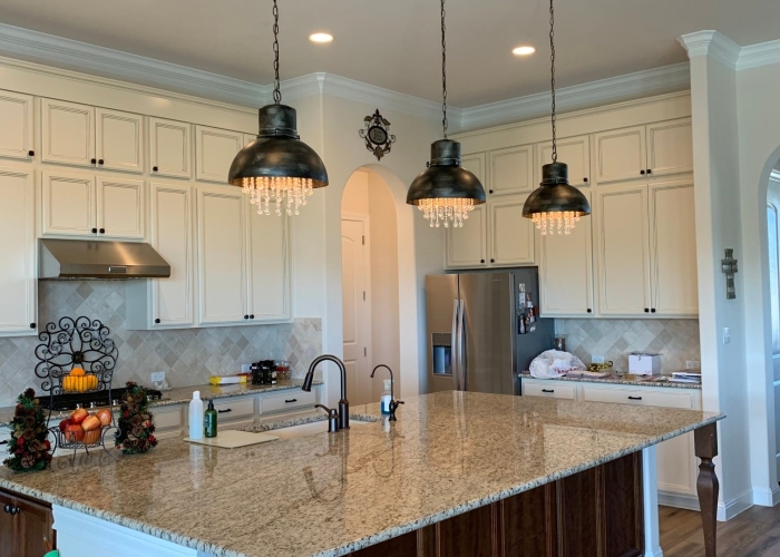 Kitchen island with three pendant lights.