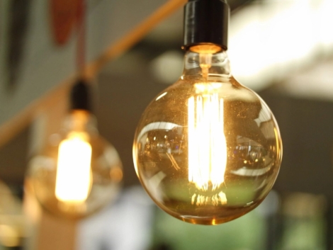 Glowing vintage light bulb hanging.